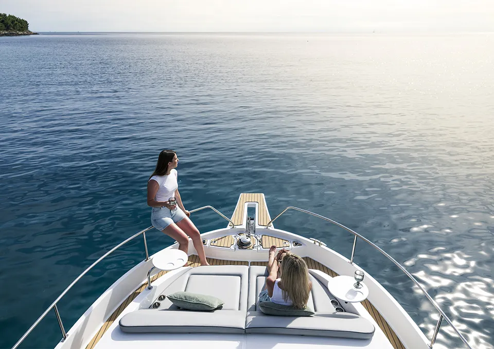 Relaxing on the foredeck of a Delphia